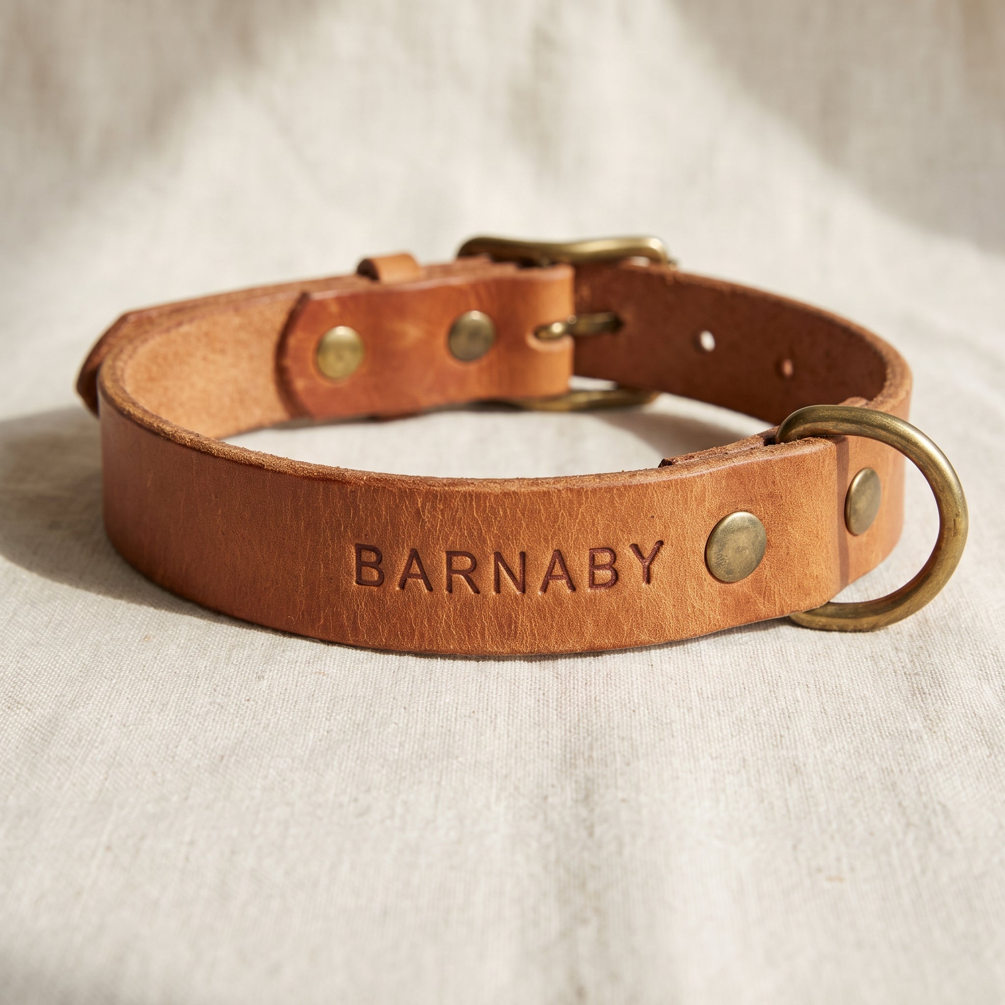 Hand-tanned leather dog collar with hand-stamped custom engraving, made to order