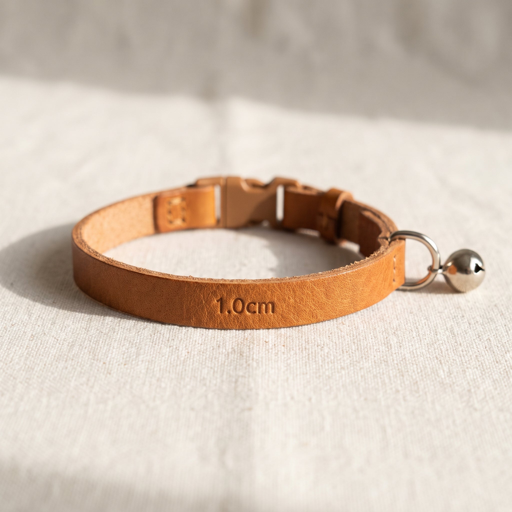 Narrow caramel leather cat collar with breakaway safety buckle, 1.0cm width
