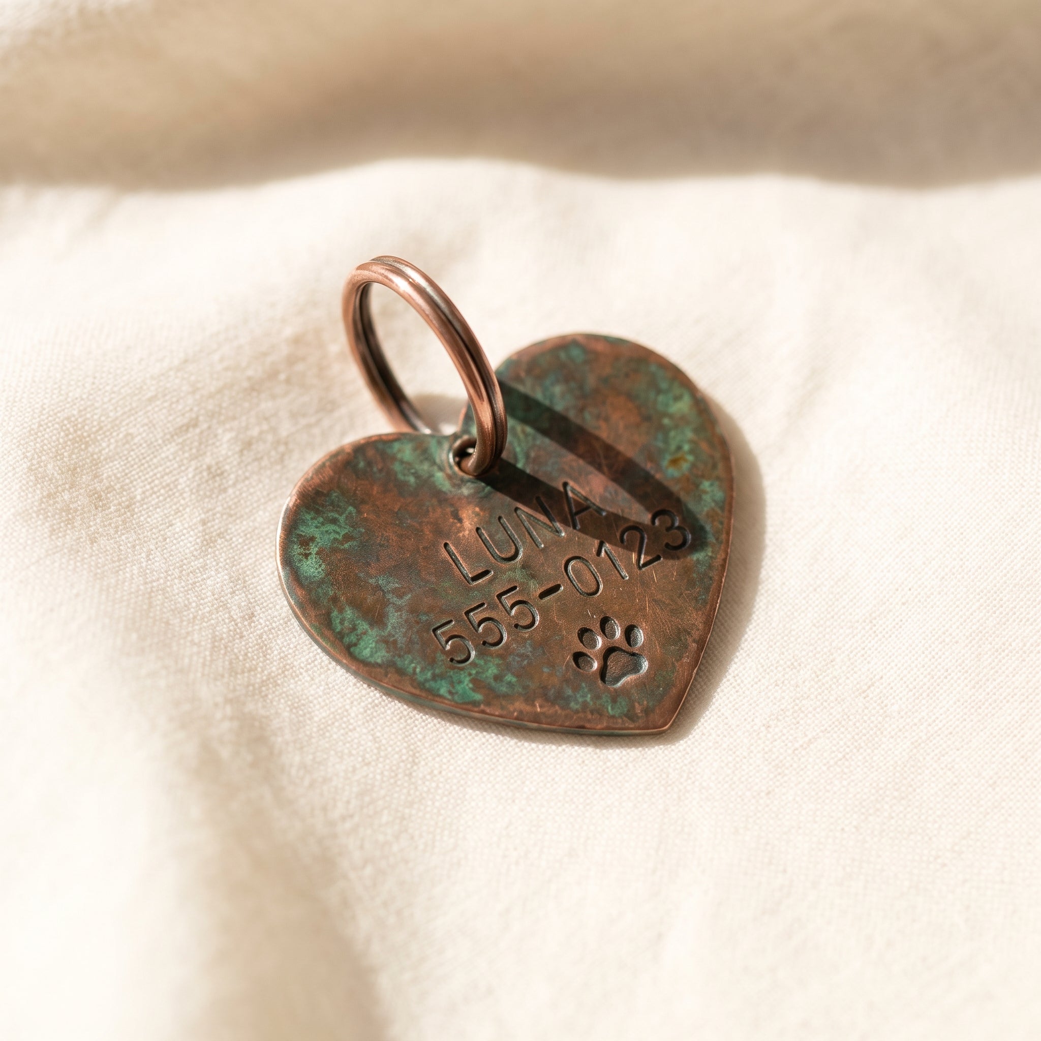 Hand-formed copper heart ID tag, 2.8cm, natural patina, engraved with name and number